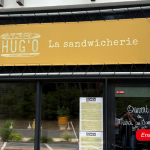 Enseigne bâche réalisée pour la sandwicherie Hug’O.